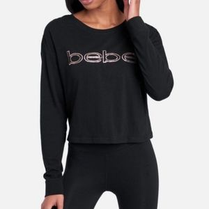 Bebe Women's Gold Sequin Logo Long Sleeve Black Top with trim on the shoulders